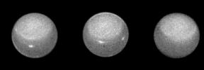 These three NASA Hubble Space Telescope images of the planet Uranus reveal the motion of a pair of bright clouds in the planet's southern hemisphere, and a high altitude haze that forms a 'cap' above the planet's south pole.
