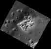 This high-resolution view from NASA's MESSENGER spacecraft shows hollows on the southwestern peak ring of the Scarlatti basin. The hollows are the irregularly shaped, flat-floored depressions.