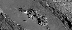 This mosaic of oblique images from NASA's MESSENGER spacecraft highlights the spectacular interior of Abedin crater. The crater floor is covered with once-molten rock melted by the impact event that formed Abedin.