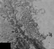 In the center of this 300-mile (470-kilometer) wide image of Pluto from NASA's New Horizons spacecraft is a large region of jumbled, broken terrain on the northwestern edge of the vast, icy plain informally called Sputnik Planum, to the right.